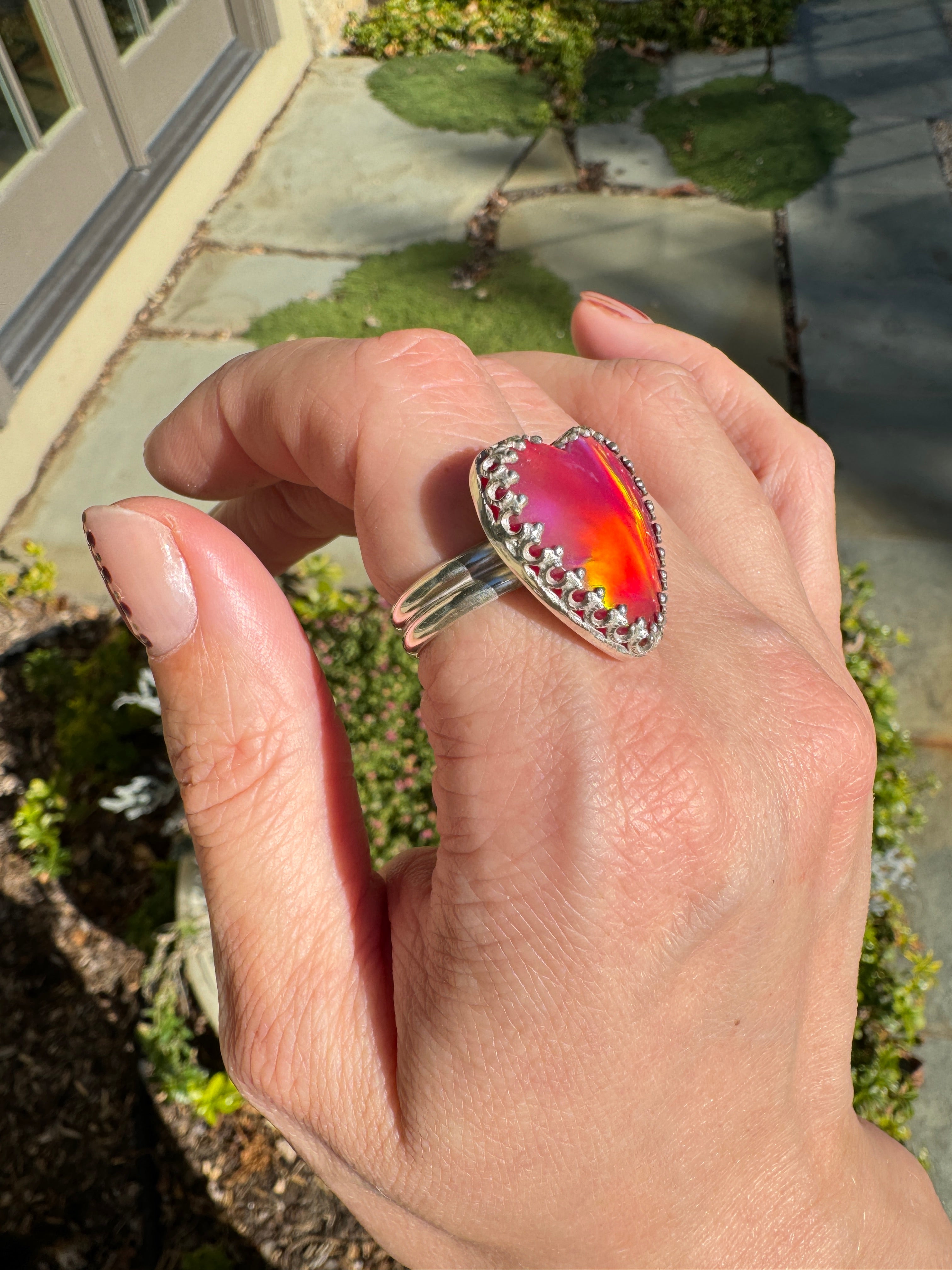 Beautiful heart shaped Aurora Opal on a wide sterling silver double band. Pretty tones of pink and red.  One of a kind. The perfect heart ring for Valentine's Day. Size 8