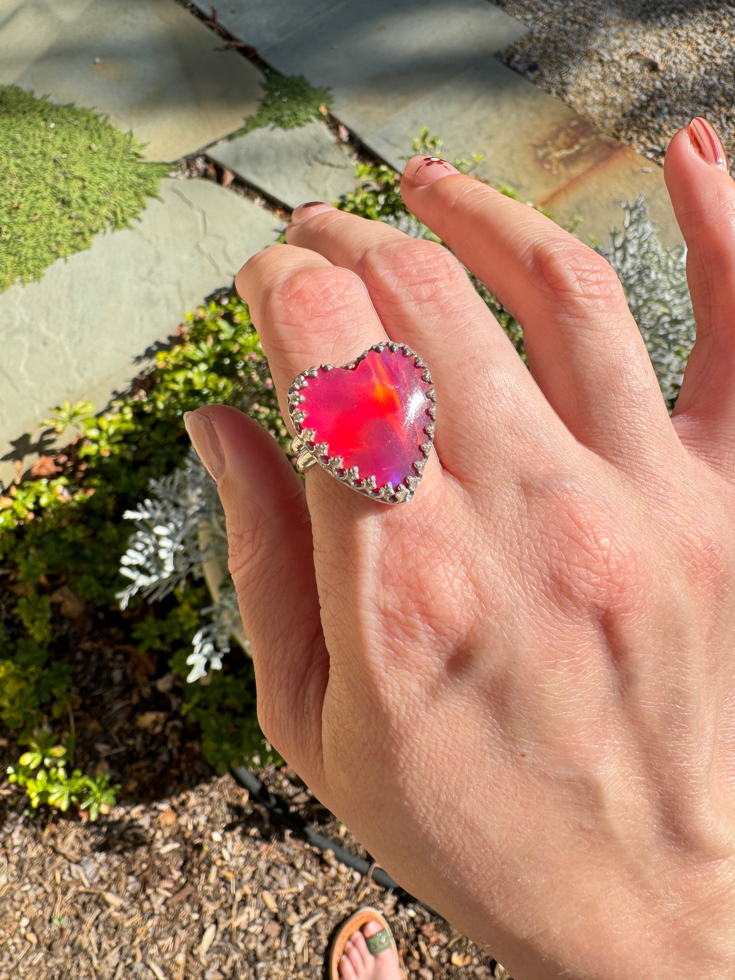 Beautiful heart shaped Aurora Opal on a wide sterling silver double band. Pretty tones of pink and red.  One of a kind. The perfect heart ring for Valentine's Day. Size 8