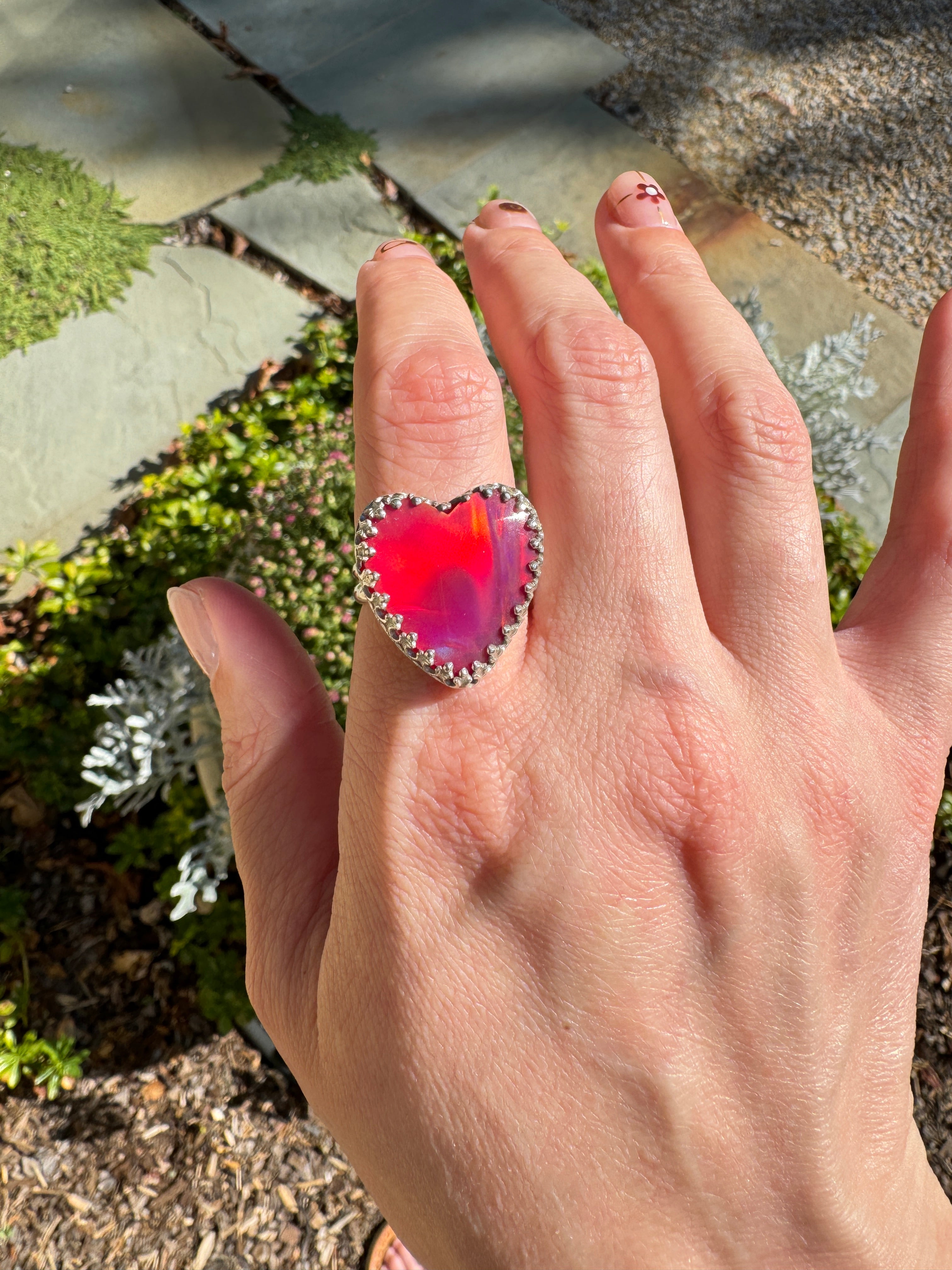 Beautiful heart shaped Aurora Opal on a wide sterling silver double band. Pretty tones of pink and red.  One of a kind. The perfect heart ring for Valentine's Day. Size 8