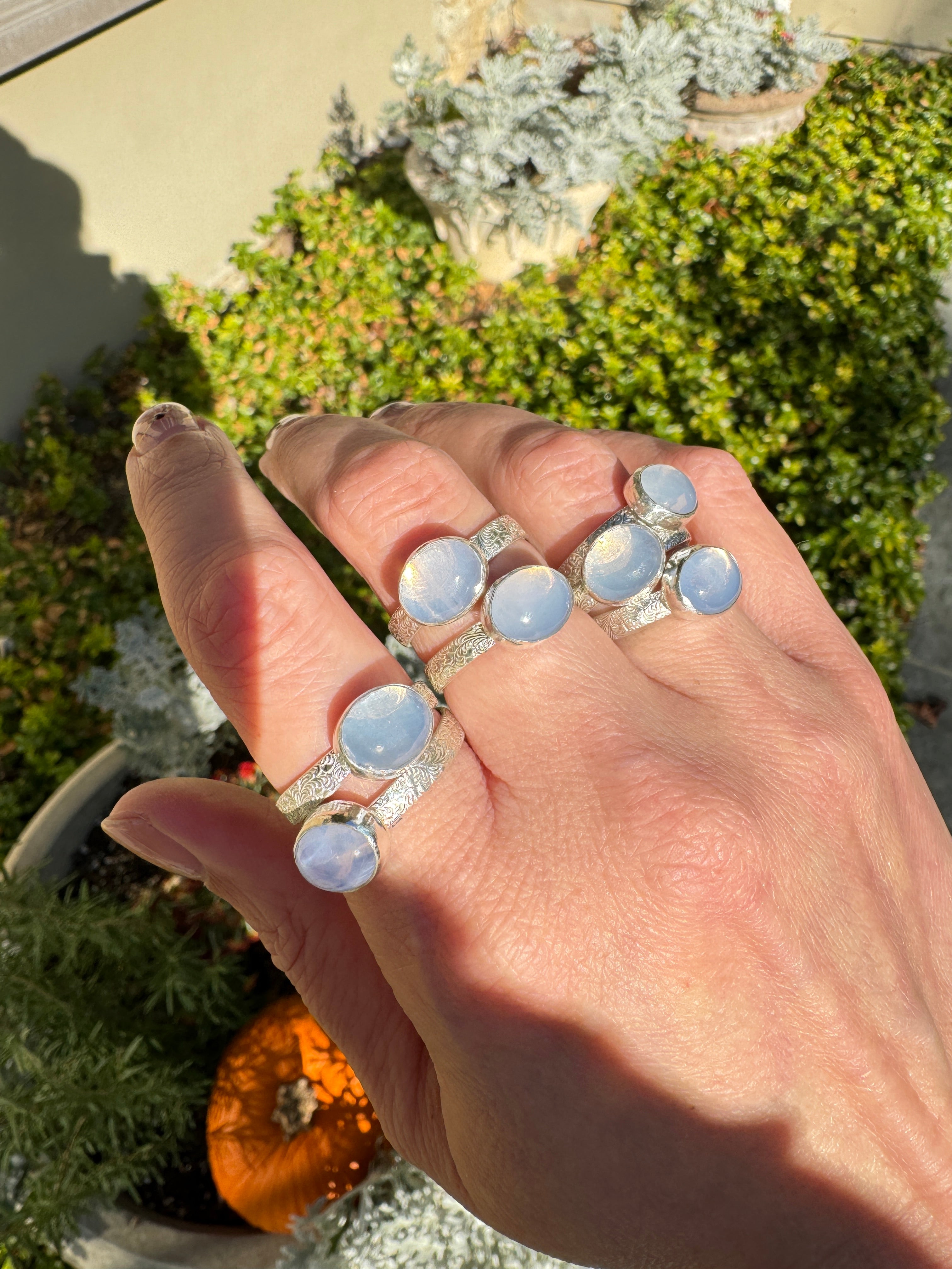 Sparkling lavender moon quartz on shiny sterling silver patterned bands