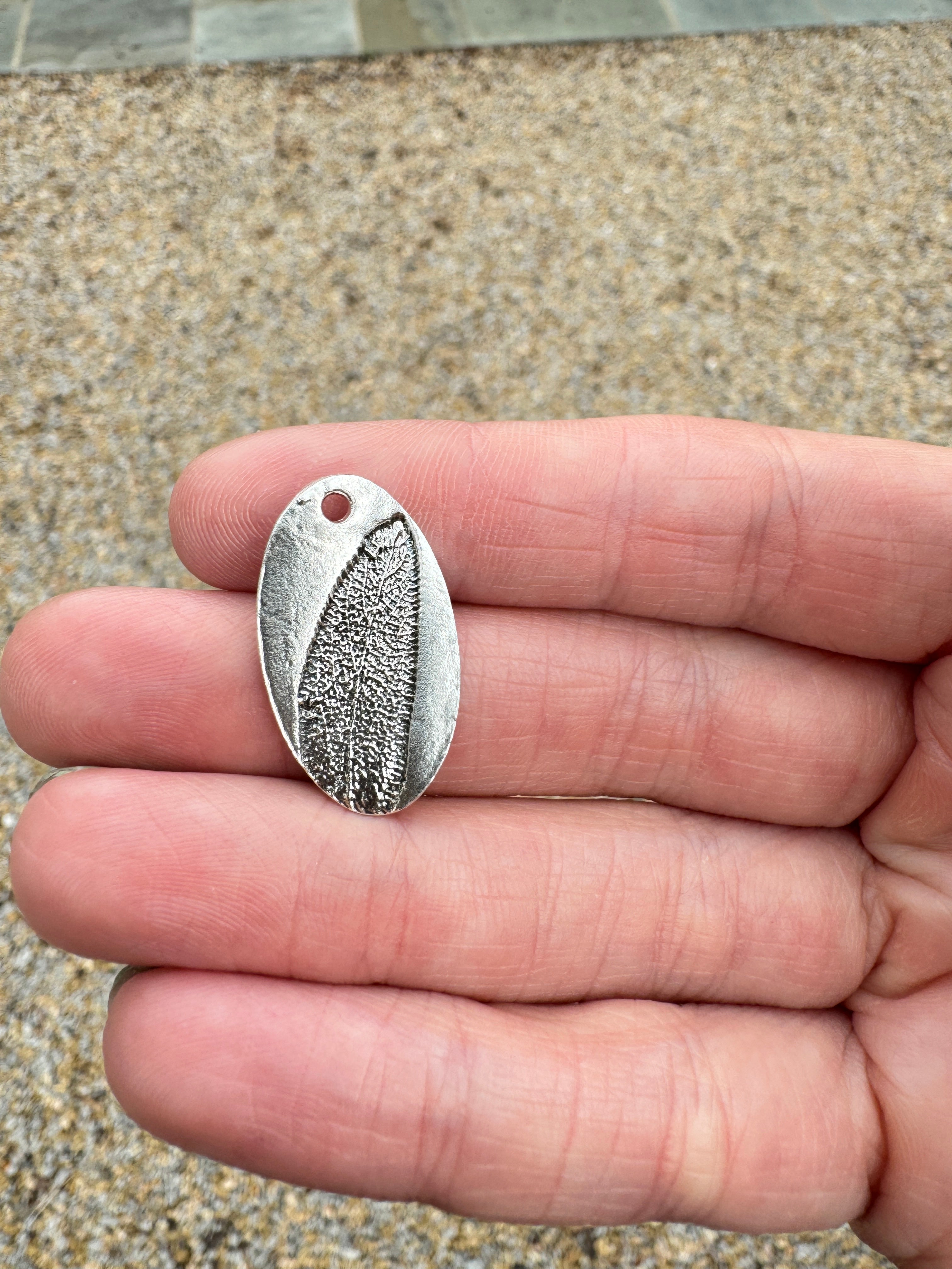 Sage imprint pendant in fine silver with a sterling silver bail. Choose between a 16" or 18" sterling silver chain. Each pendant is hand pressed and one of a kind.