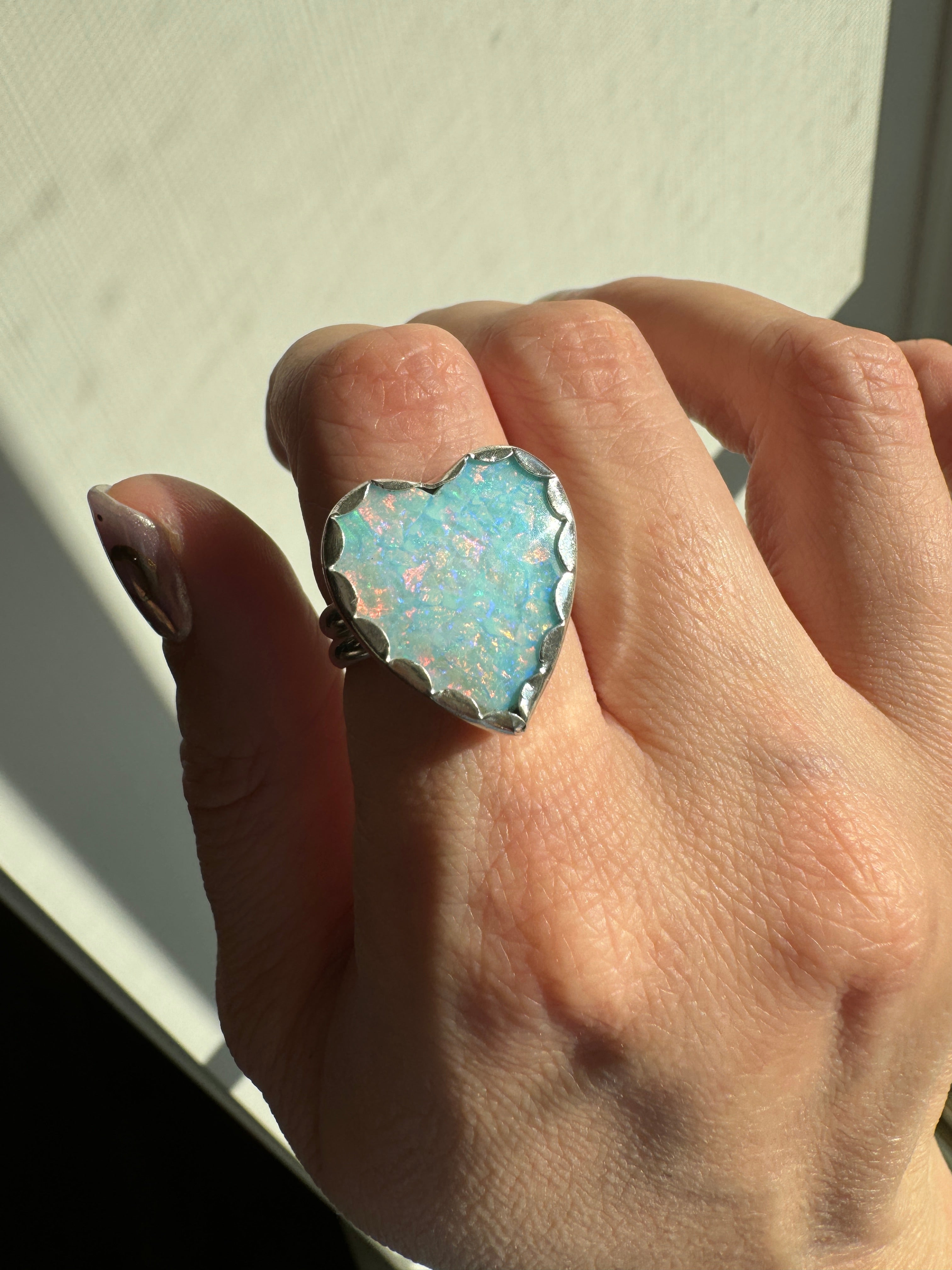 Beautiful heart shaped Sterling Opal on a wide sterling silver double band. One of a kind. The perfect sparkly silver ring for Valentine's Day. Size 8.25