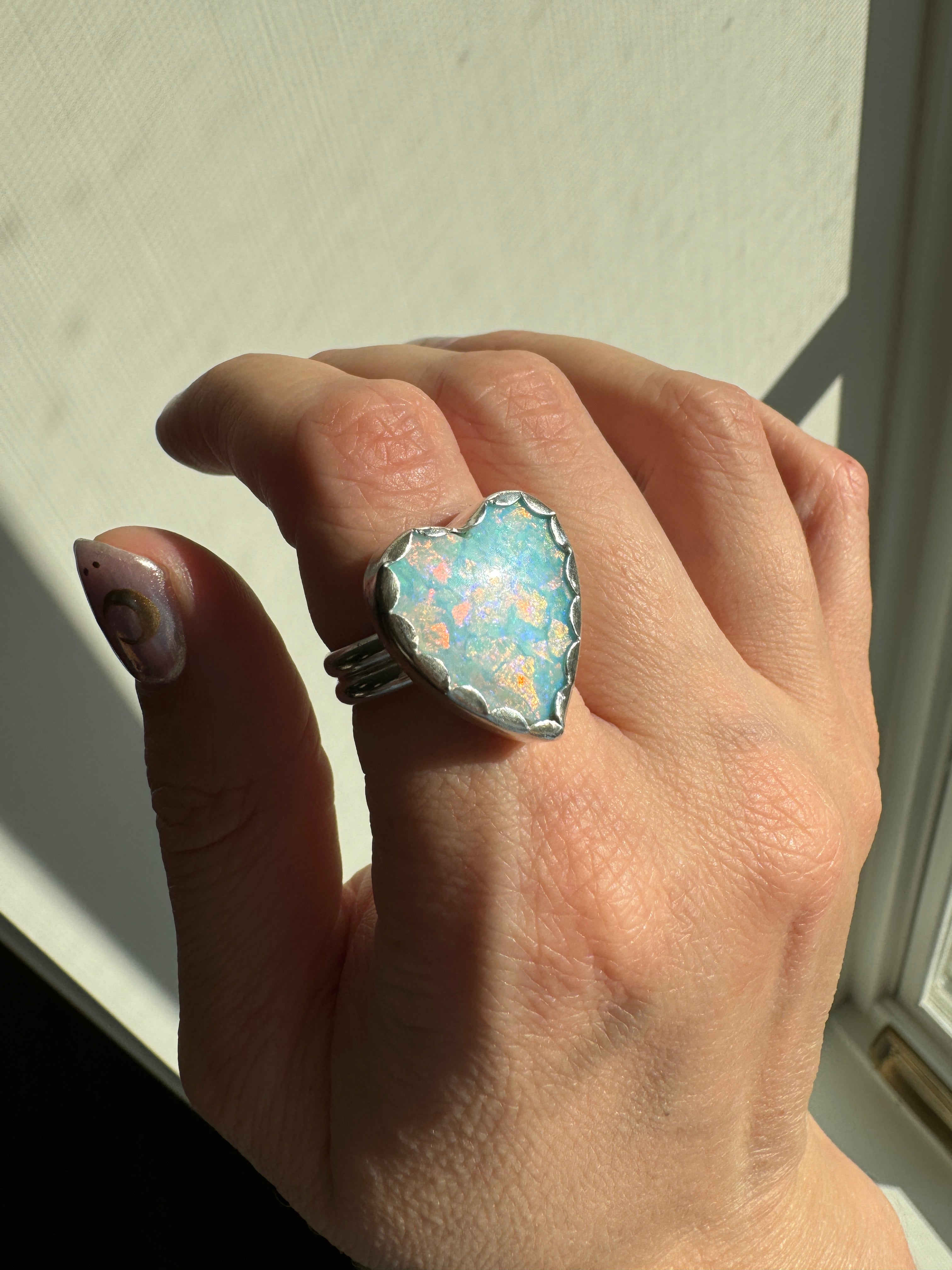 Beautiful heart shaped Sterling Opal on a wide sterling silver double band. One of a kind. The perfect sparkly silver ring for Valentine's Day. Size 8.25