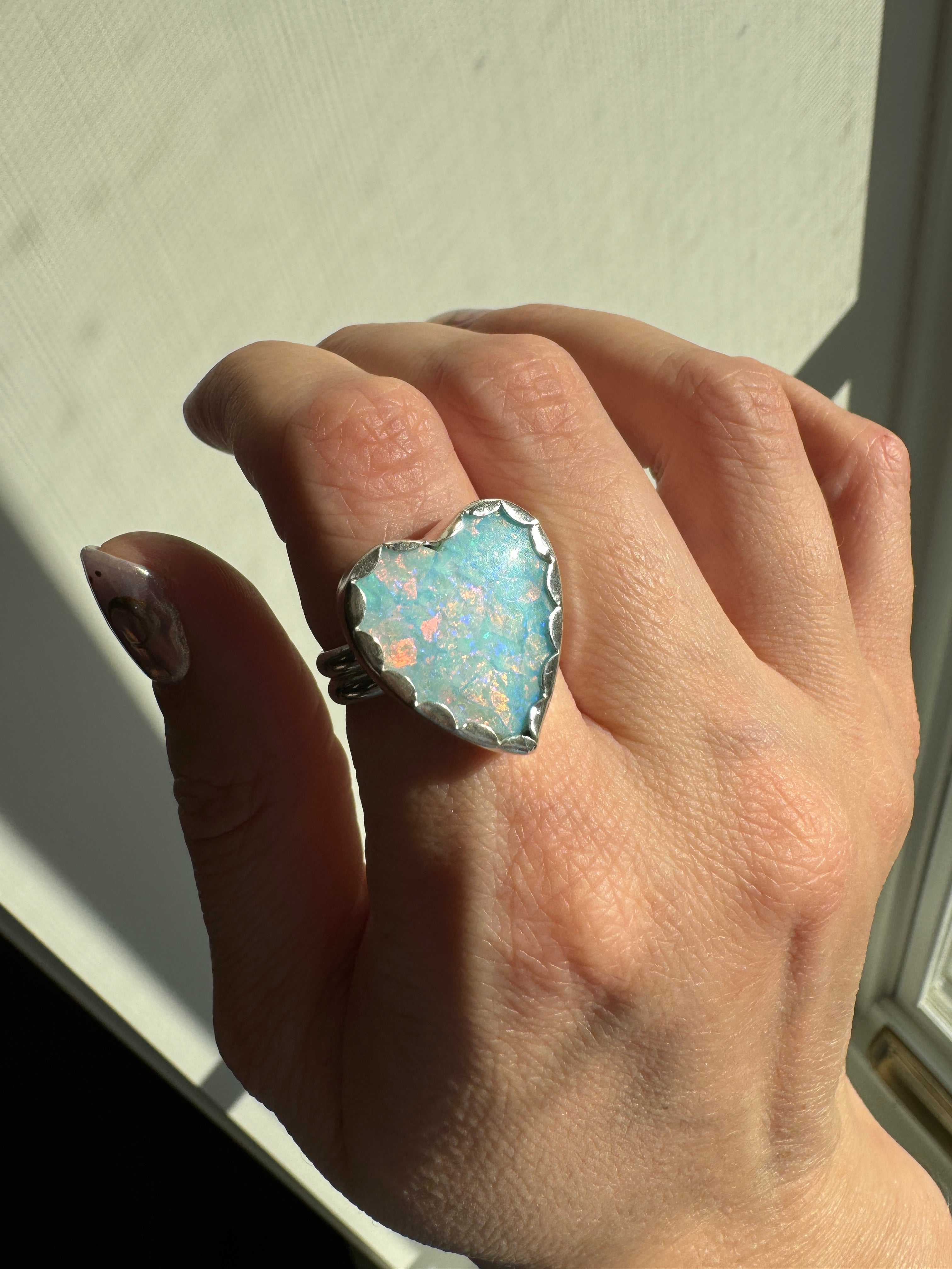 Beautiful heart shaped Sterling Opal on a wide sterling silver double band. One of a kind. The perfect sparkly silver ring for Valentine's Day. Size 8.25