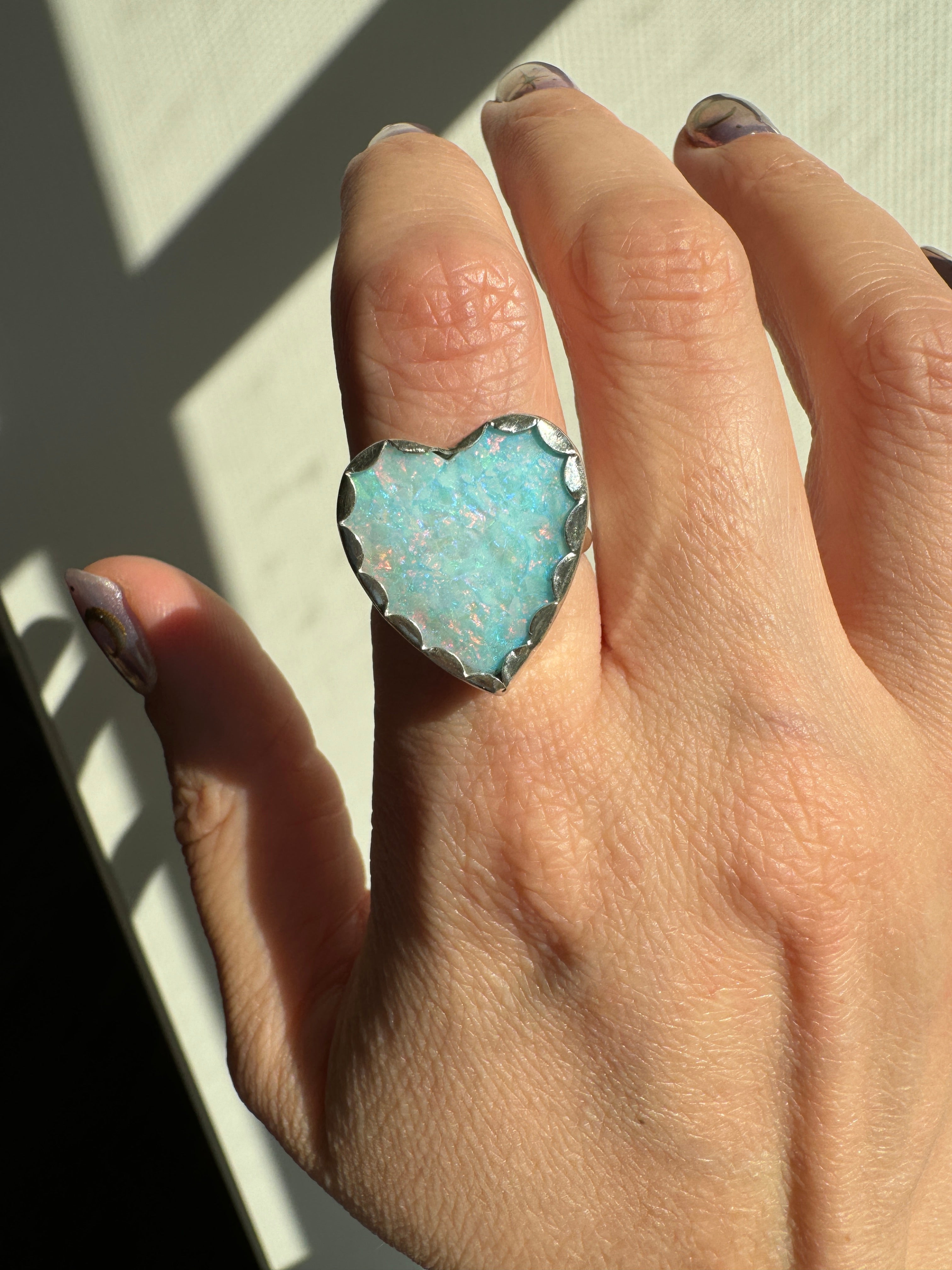 Beautiful heart shaped Sterling Opal on a wide sterling silver double band. One of a kind. The perfect sparkly silver ring for Valentine's Day. Size 8.25