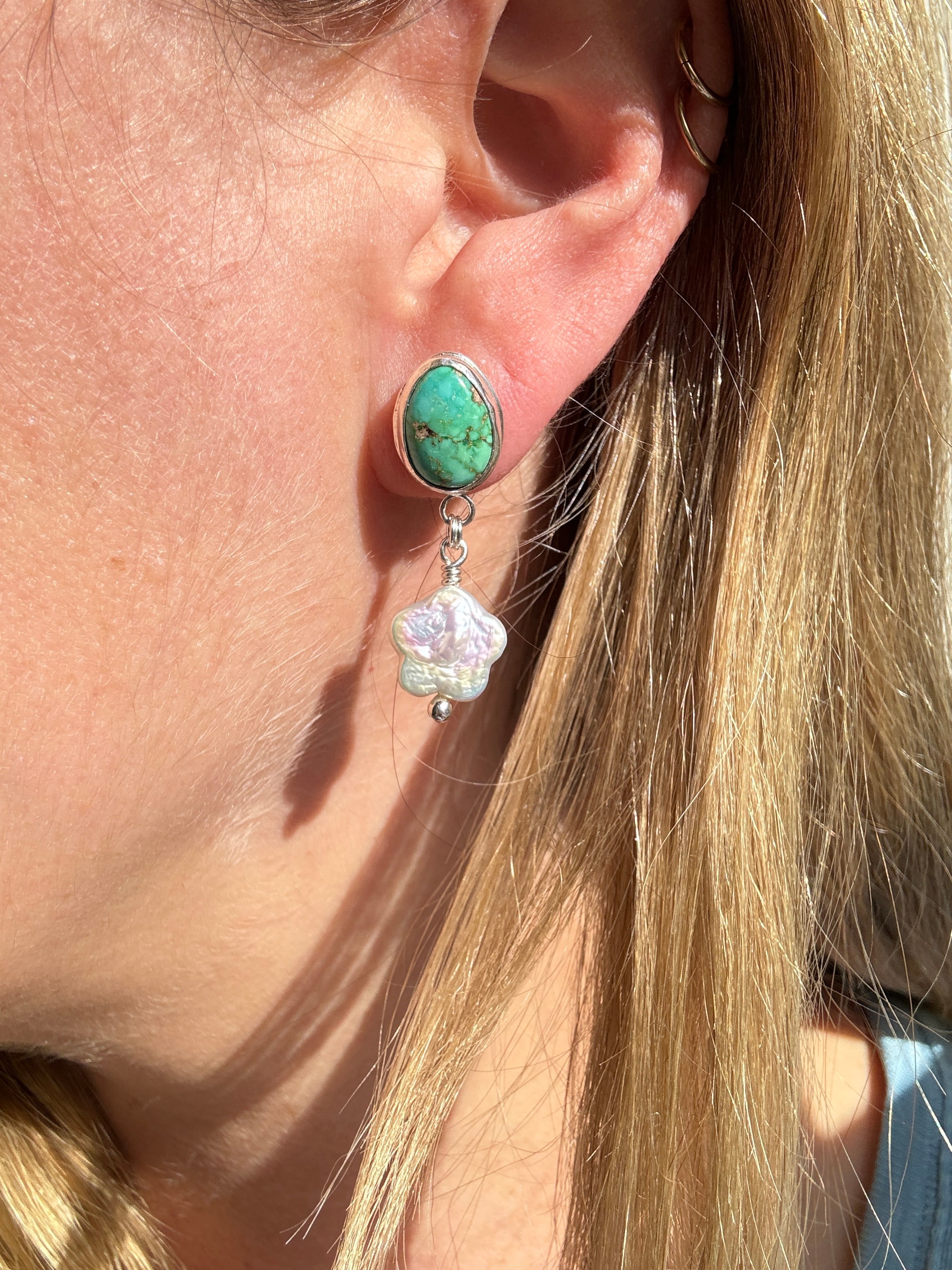 Verde Valley Turquoise set in a fine silver bezel with flower shaped pearls dangling below. The posts and ear backs are sterling silver.