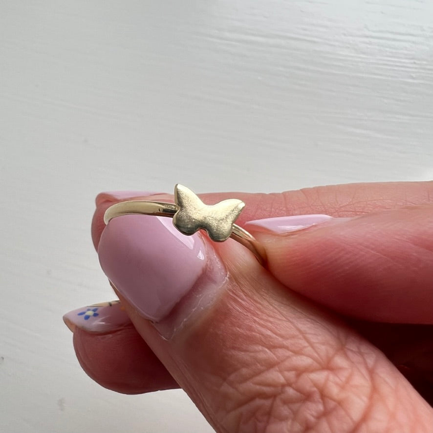 Delicate 14k gold butterfly stacker ring