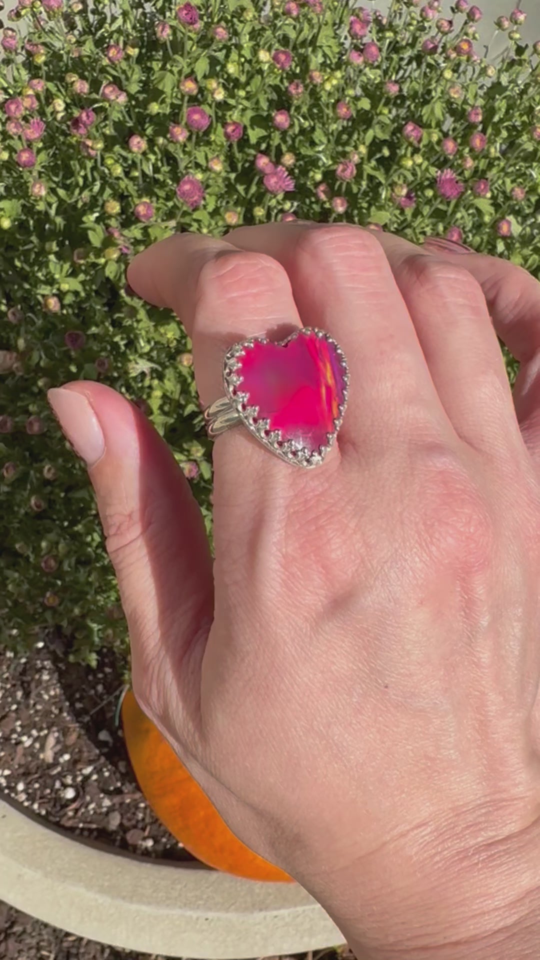 Beautiful heart shaped Aurora Opal on a wide sterling silver double band. Pretty tones of pink and red.  One of a kind. The perfect heart ring for Valentine's Day. Size 8